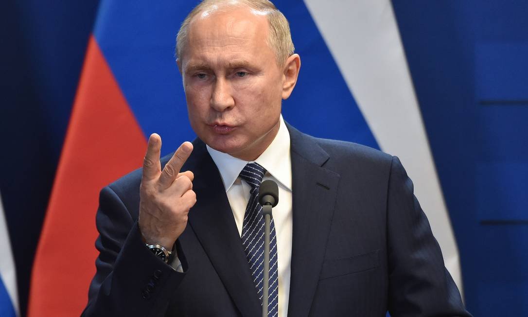 85442268_Russian-President-Vladimir-Putin-gestures-as-he-addresses-a-press-conference-with-the-Hunga.jpeg