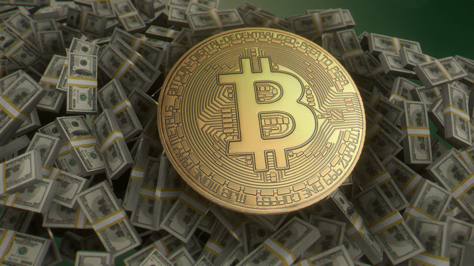 One_bitcoin_sitting_atop_bundles_of_US_100_notes.png
