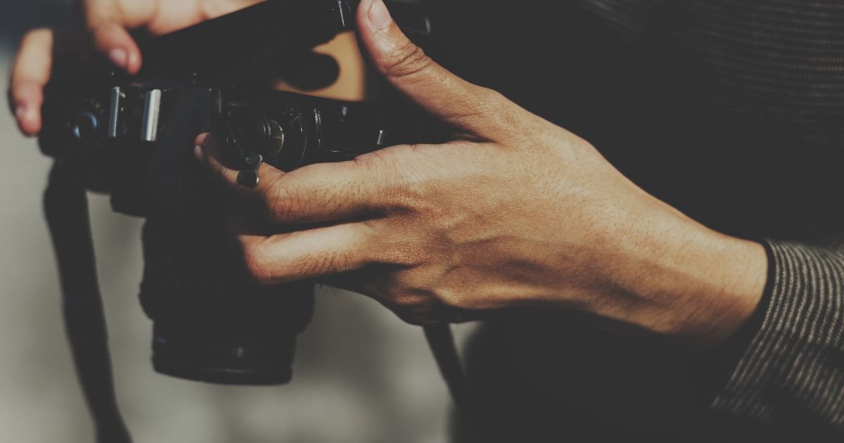 closeup-hands-checking-film-camera.jpg
